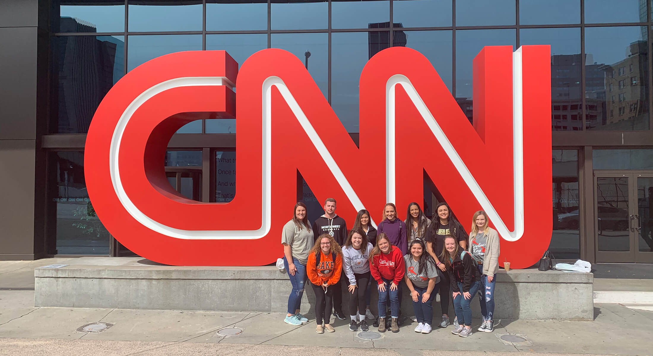 Cardinal Key members posing in front of the CNN office